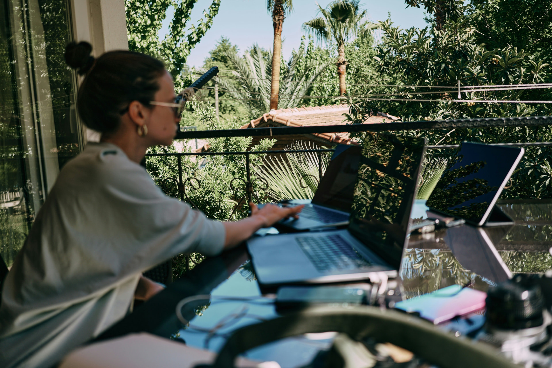 Remote professional working on a laptop outdoors